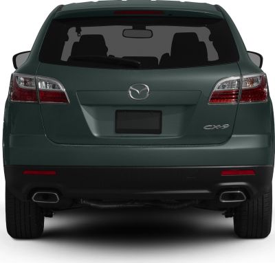 Rear view showing tail lights, dual exhaust tips, and rear window with wiper