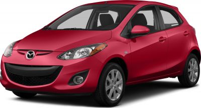 Front-side view of red hatchback with detailed headlights and black grille