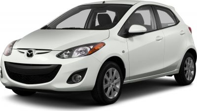 White hatchback front three-quarter view with alloy wheels and headlights