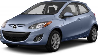 Front side view of hatchback with headlights, alloy wheels