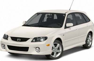 Front angled view with headlamps, grille, and alloy wheels