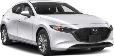 Front-side view with large black mesh grille and sharp headlights