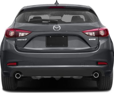 Rear view showing hatchback taillights and dual exhaust pipes