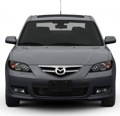 Front view with headlights, grille, and bumper of a sedan