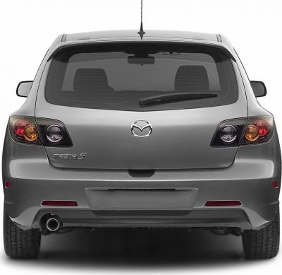 Rear hatchback view with distinctive tail lights and exhaust pipe.