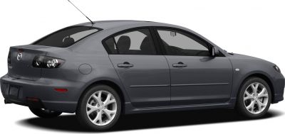 Rear and side profile of a compact sedan with alloy wheels and tinted windows
