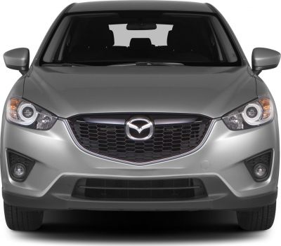 Front view with distinctive grille, circular headlights, and fog lamps