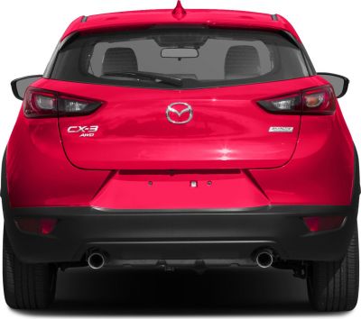 Rear view with dual exhausts, AWD and Skyactiv technology badges