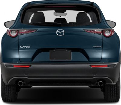 Rear view with signature taillights and dual exhausts