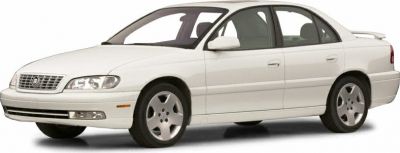 White four-door luxury sedan with alloy wheels and smooth body lines