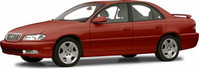 1990s sedan with distinctive grille and rear spoiler.