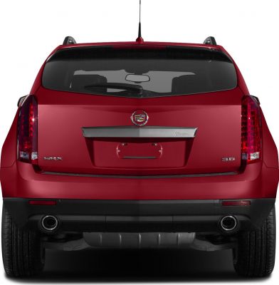 Rear view with vertical taillights, dual exhausts, and rear window wiper