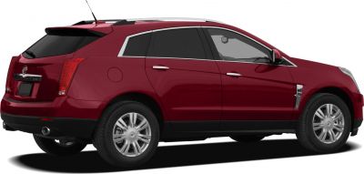 Rear and side view of a mid-size crossover SUV with chrome trim and rear spoiler