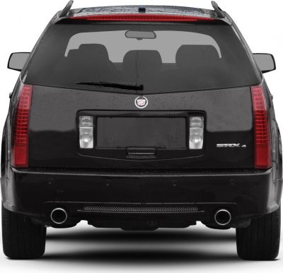 Rear view with vertical tail lights and dual exhaust pipes