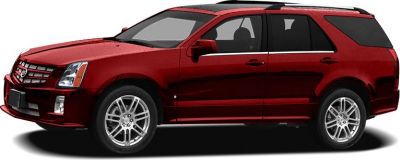 Front side view of red luxury SUV with alloy wheels and roof rails
