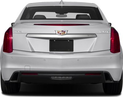 Vertical tail lights and sharp trunk design of a luxury sedan rear