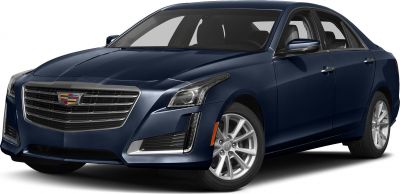 Prominent chrome grille with vertical LED headlights on a luxury sedan front side.