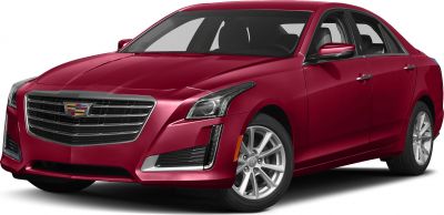 Front exterior and headlights of a red luxury sedan