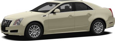 Side view of beige sedan with chrome grille and alloy wheels