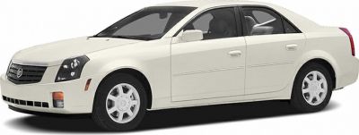 White sedan front and side view with distinctive grille and body lines