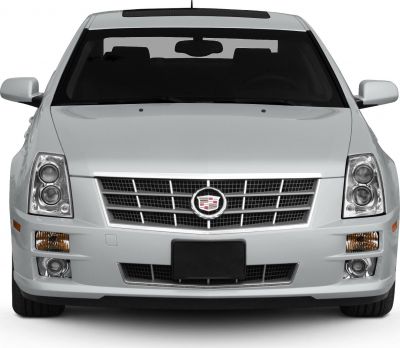 Distinctive grille with emblem and dual round headlights on front view.