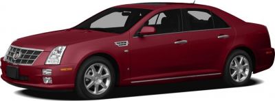 Red luxury sedan with chrome grille and alloy wheels, four-door design