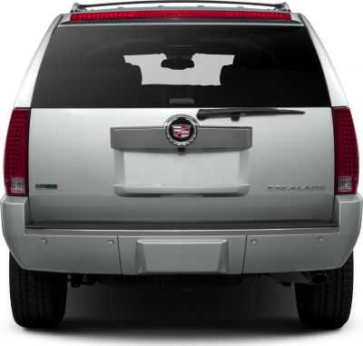 Rear view with distinctive tail lights, rear wiper, and emblem on a luxury SUV