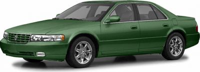 Green sedan with distinctive front grille and alloy wheels