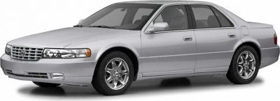 Silver luxury sedan with chrome wheels and large grille.