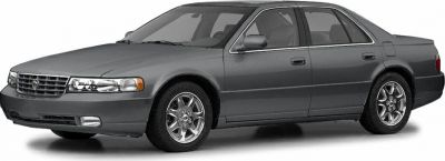 Side profile of a luxury sedan with chrome wheels and smooth body design
