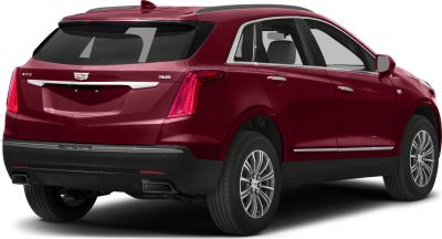 Vertical LED tail lights and dual exhaust outlets on luxury SUV rear