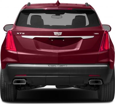 Rear view of SUV with vertical tail lights and dual rectangular exhausts