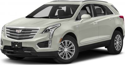 Luxury SUV front view with LED headlights and chrome grille.