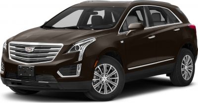 Front side view of SUV with LED headlights and chrome-accented grille.
