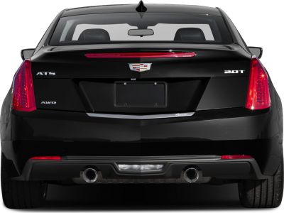 Rear view of black coupe with dual exhaust and vertical LED taillights