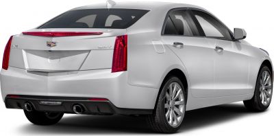 Rear view showing vertical taillights, dual exhaust tips, and sleek sedan design