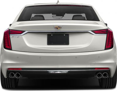 Luxury sedan rear with quad exhaust and sleek tail lights