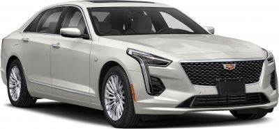 Front 3/4 view of a luxury sedan with distinctive grille and LED headlights