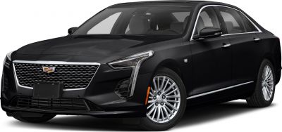 Luxury sedan front view with vertical LED headlights and prominent grille