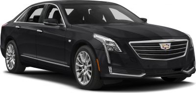 Luxury sedan with vertical LED headlights and large chrome grille