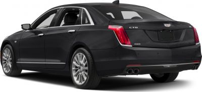 Luxury sedan rear view with LED taillights and quad exhaust pipes