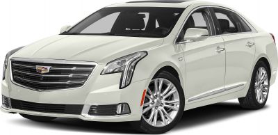 Front view of a luxury sedan with vertical LED headlights and chrome grille
