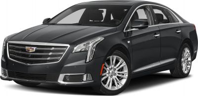 Luxury black sedan front with chrome grille and vertical LED headlights.