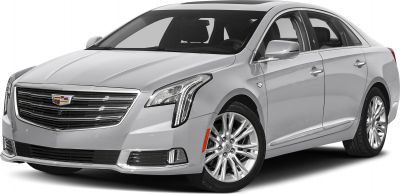 Silver sedan with vertical LED headlights and chrome grille