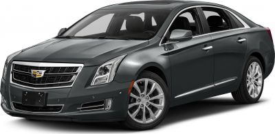 Luxury sedan with chrome grille and alloy wheels in front side view