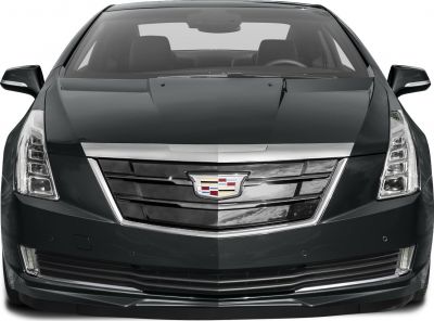 Close-up front of vehicle with distinctive grille and vertical LED headlights