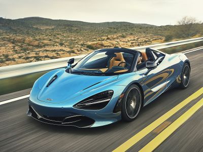 Front-side view of aerodynamic convertible sports car in motion