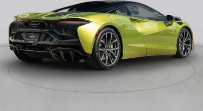 Rear angled view showing aerodynamic body and sporty wheels