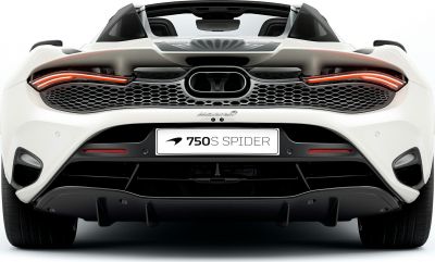 Rear view of a convertible sports car with prominent exhaust and aerodynamics