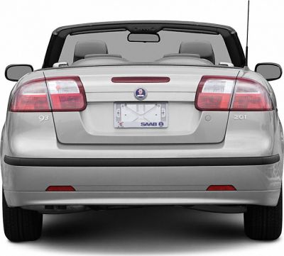 Rear view of silver convertible with open roof and dual headrests